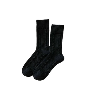 Classic black cable knit crew socks in thick warm wool blend for winter fashion styling