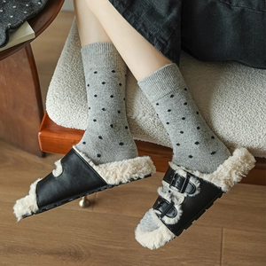 Polka dot wool socks paired with warm faux fur lined buckle sandals for winter