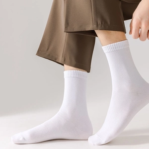 Detailed macro view of white cotton mid-calf sock with high-elastic ribbed cuffs