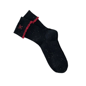 Sparkly black knit socks with red ruffle trim and embroidered bows for a sweet style