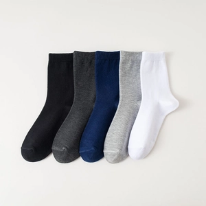 Five pairs of men's cotton mid-calf socks in black, grey, navy, and white solid colors