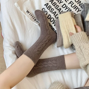 Detailed knit texture of thick wool socks in warm earth tones for winter comfort