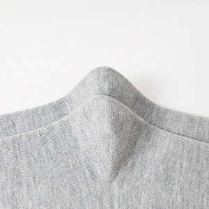 Macro shot of seamless toe stitching on heather grey breathable cotton crew socks