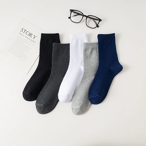 Detailed knit texture and ribbed cuffs of 5-pack cotton mid-tube socks in assorted colors