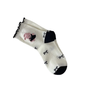 Cute white crew socks with pink bunny embroidery, black bows, and lace ruffle trim
