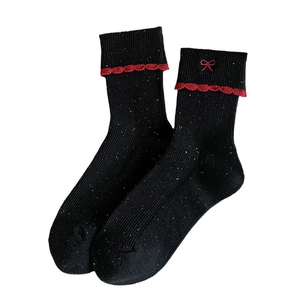 Sweet ballet style black crew socks with red ruffle trim and embroidered bow details