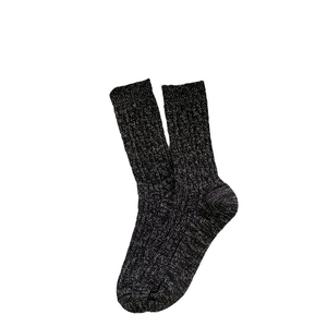 Thick dark grey cable knit wool socks for women providing warmth in winter