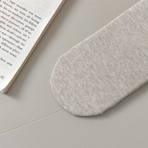 Close-up of flat toe seam and soft knit texture on grey mid-calf cotton socks