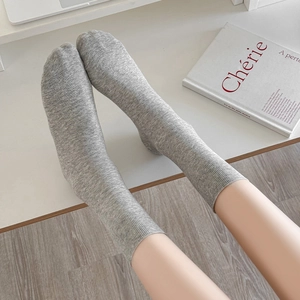 Mid-calf gray knit cotton socks with ribbed texture for women in minimalist style