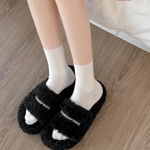 Women's fluffy black platform slides with letter embroidery and white crew socks