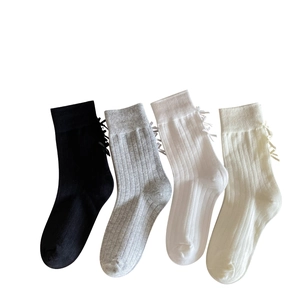 White and grey ballet style crew socks with back ribbon bows in a four-color set