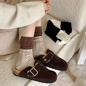 Women's dark brown suede mules with faux fur lining and cable knit color-block socks