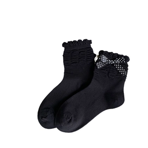 Black crew socks with ruffled lace cuffs and polka dot bow, sweet jk style for women