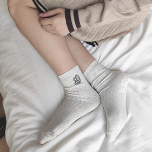 Calze color crema con coriandoli, ricamo floreale e trama a costine per donne