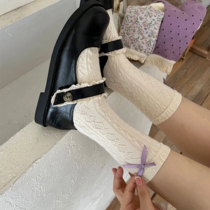 Lace ruffle socks in cream white with purple bow detail and hollow knit pattern