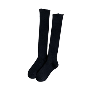 Japanese style black vertical ribbed knee high socks with delicate ruffled cuffs for women