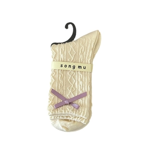 French romantic off-white knit socks with purple satin bow and vintage cable patterns