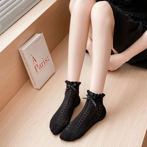 Black lace Lolita socks with mesh hollow texture and bows shown from a 45-degree angle