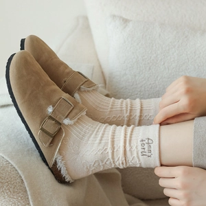 Brown suede mules with plush lining and cream knit socks with embroidery detail