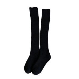 Classic black knee high socks for women with vertical rib knit texture and elastic cuffs