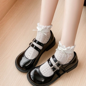 Lace trim Lolita socks with bows paired with black patent leather Mary Jane shoes