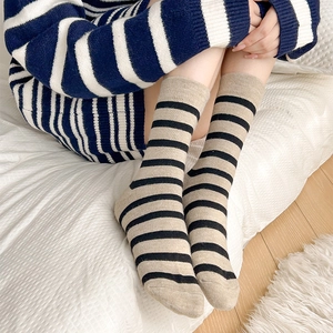 Women's cozy wool-blend striped crew socks featuring letter embroidery and warm knit texture