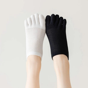 Detailed mesh texture of thin five-finger toe socks in black and white colors