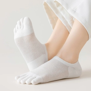 Close-up of white mesh five-finger socks showing breathable knit texture and toe separation
