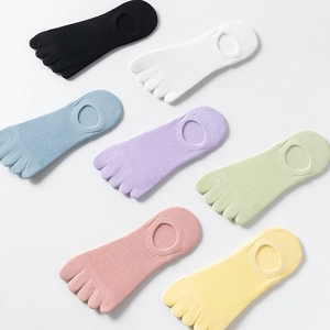 Detail of seven colorful mesh five-toe socks with silicone non-slip heel and cut-out design