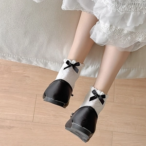 White Lolita lace ankle socks with black bows and ruffled cuffs for women