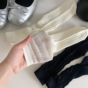Close-up of sheer mesh socks with vertical wave texture and breathable thin fabric