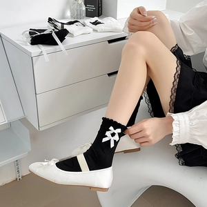 Japanese JK style black mid-calf socks with white bows and frilled edges for Lolita look