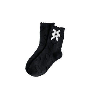 Japanese style black mid-calf socks with white satin bows and heart jacquard pattern