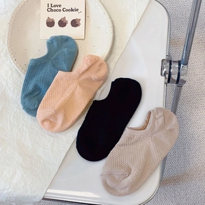 Detail showing breathable mesh cotton boat socks in blue, beige, and black for summer