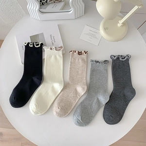 Set of 5 minimalist rib knit crew socks with ruffled edges in neutral solid tones