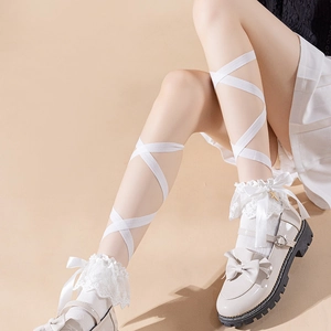 White Lolita lace socks with silk bow and criss-cross straps worn with Mary Jane shoes