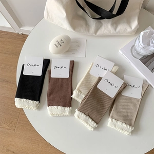 Detailed close-up of 5-pack ribbed crew socks with white lace trim in various neutral colors