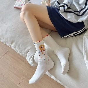 White crew socks with cute cartoon sheep and colorful dots for casual daily wear