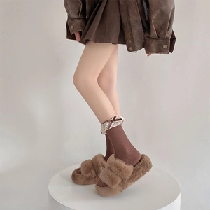 Detail of warm brown plush slide slippers with lace trim socks in sweet Japanese style