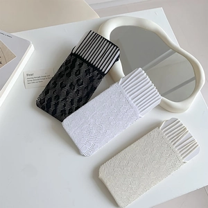 Detailed view of hollow lace socks in black, white, and beige with breathable patterns