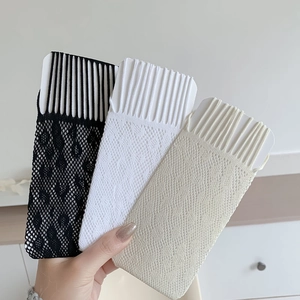 Close-up of lace mesh over-the-knee socks in black, white and cream color options