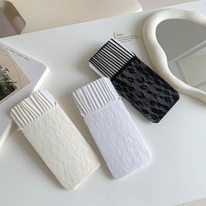 Close-up of hollow out lace mesh thigh-high socks in beige, white, and black colors