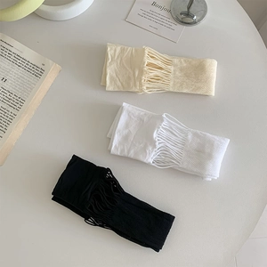 Close-up of three-color ripped mesh over-the-knee socks in white, beige, and black