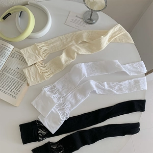 Detailed view of mesh hollow-out over-the-knee socks in white, beige, and black colors