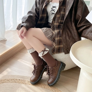 Brown platform lace-up shoes with matching bow lace socks in a cozy fall style