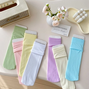 Detailed view of colorful pastel crew socks in candy tones with soft knit texture