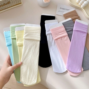 Close-up of colorful velvet crew socks in 10 vibrant pastel shades with ribbed cuffs