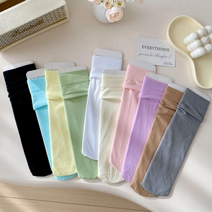 Close-up of candy-colored velvet socks set in ten pastel colors with elastic cuffs