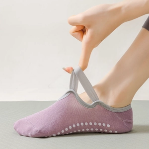 Pale purple yoga socks with elastic cross straps and non-slip silicone grip for Pilates
