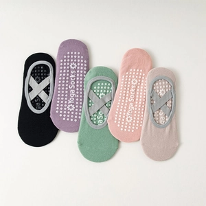 Non-slip yoga socks with cross straps in five colors including black pink and green